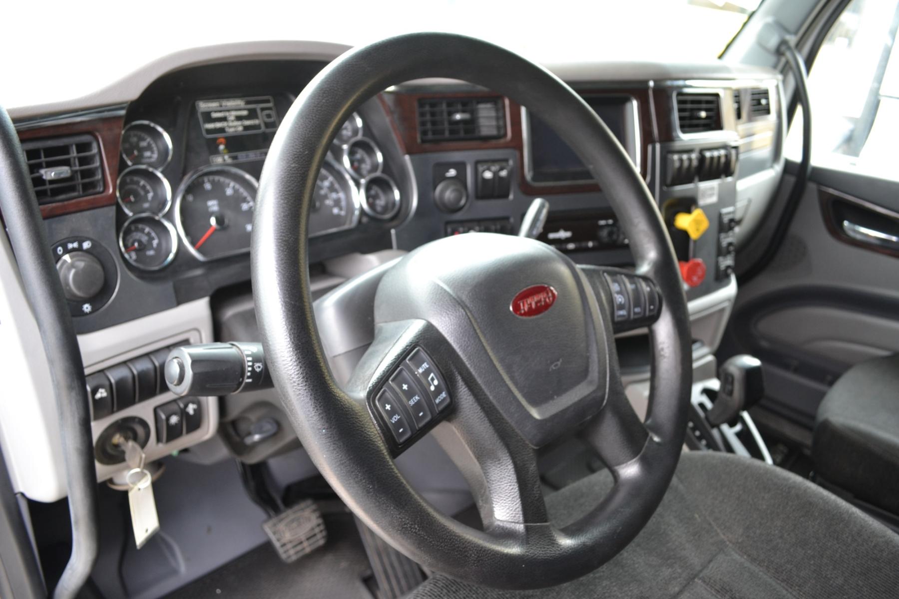 2017 WHITE /BLACK PETERBILT 579 EPIQ with an PACCAR MX13 12.9L 455HP engine, E.FULLER ADVANTAGE 10SPD AUTOMATED transmission, located at 9172 North Fwy, Houston, TX, 77037, (713) 910-6868, 29.887470, -95.411903 - 65" MID ROOF SLEEPER, DOUBLE BUNK, AIR SLIDE 5TH WHEEL, DIFF LOCK, AIR RIDE, ENGINE BRAKE, ELECTRIC APU, BUILT-IN NAVIGATION, MINI FRIDGE, ALUMINUM WHEELS, POWER WINDOWS , LOCKS, & MIRRORS, DUAL 135 GALLON FUEL TANKS, WB:230", RATIO: 2.64 - Photo #12